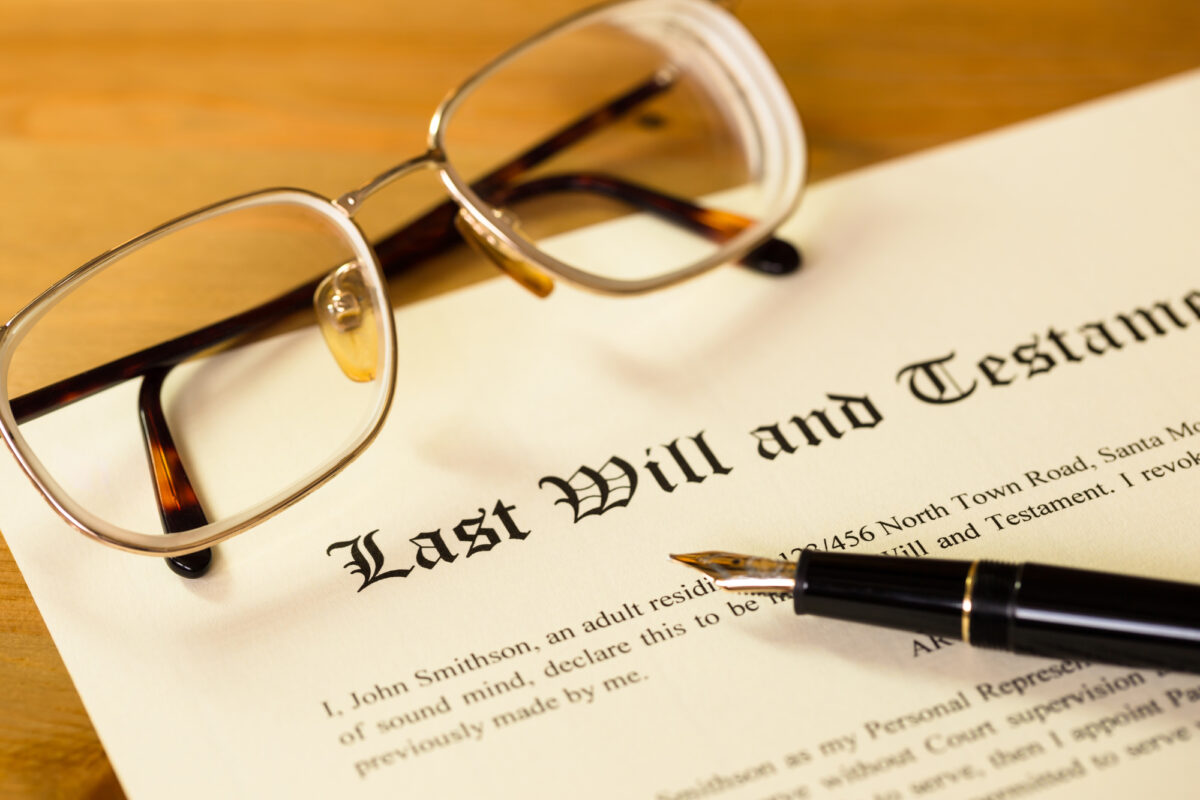 5 Key Traits To Look For In A Probate Lawyer - Last will and testament with pen and glasses concept for legal d