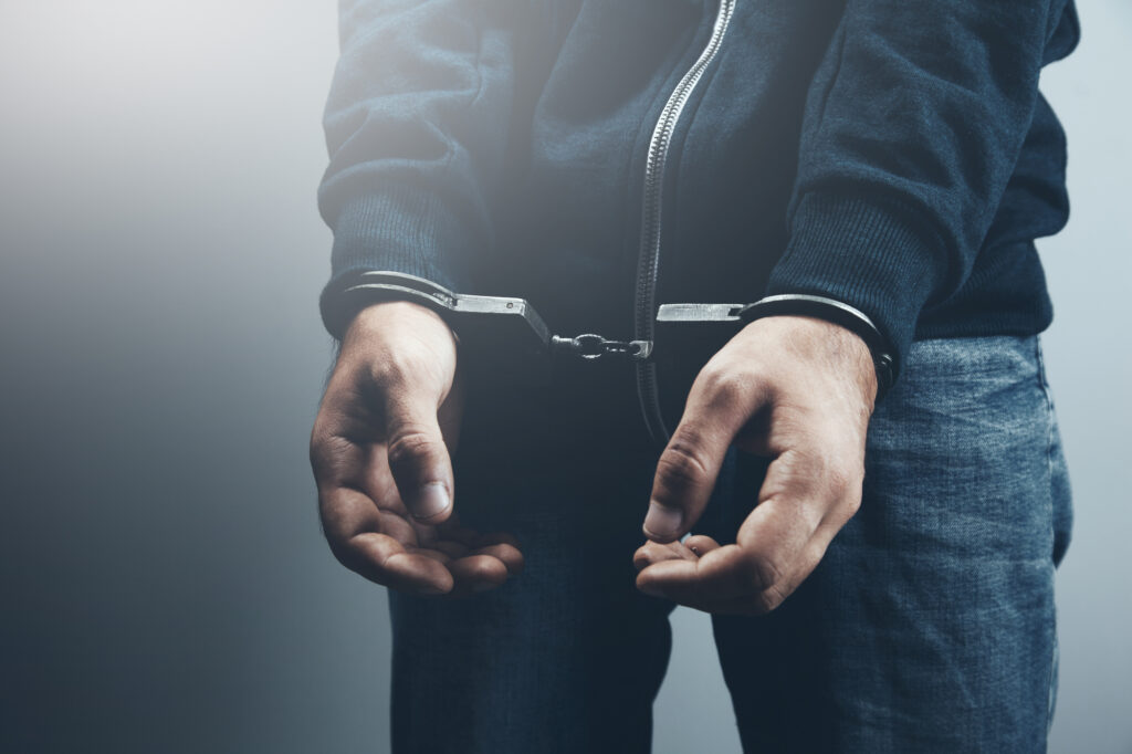 Man in handcuffs facing Double Jeopardy